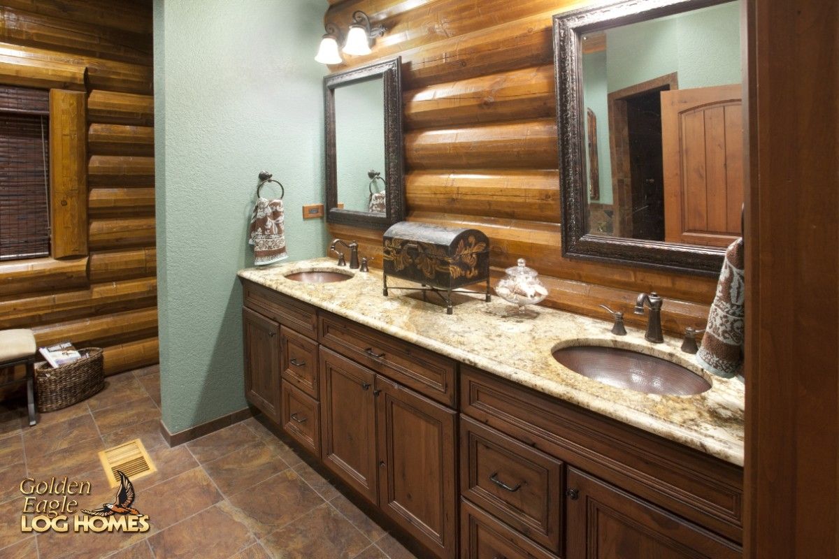 two sinks in vanity with light green wall in background