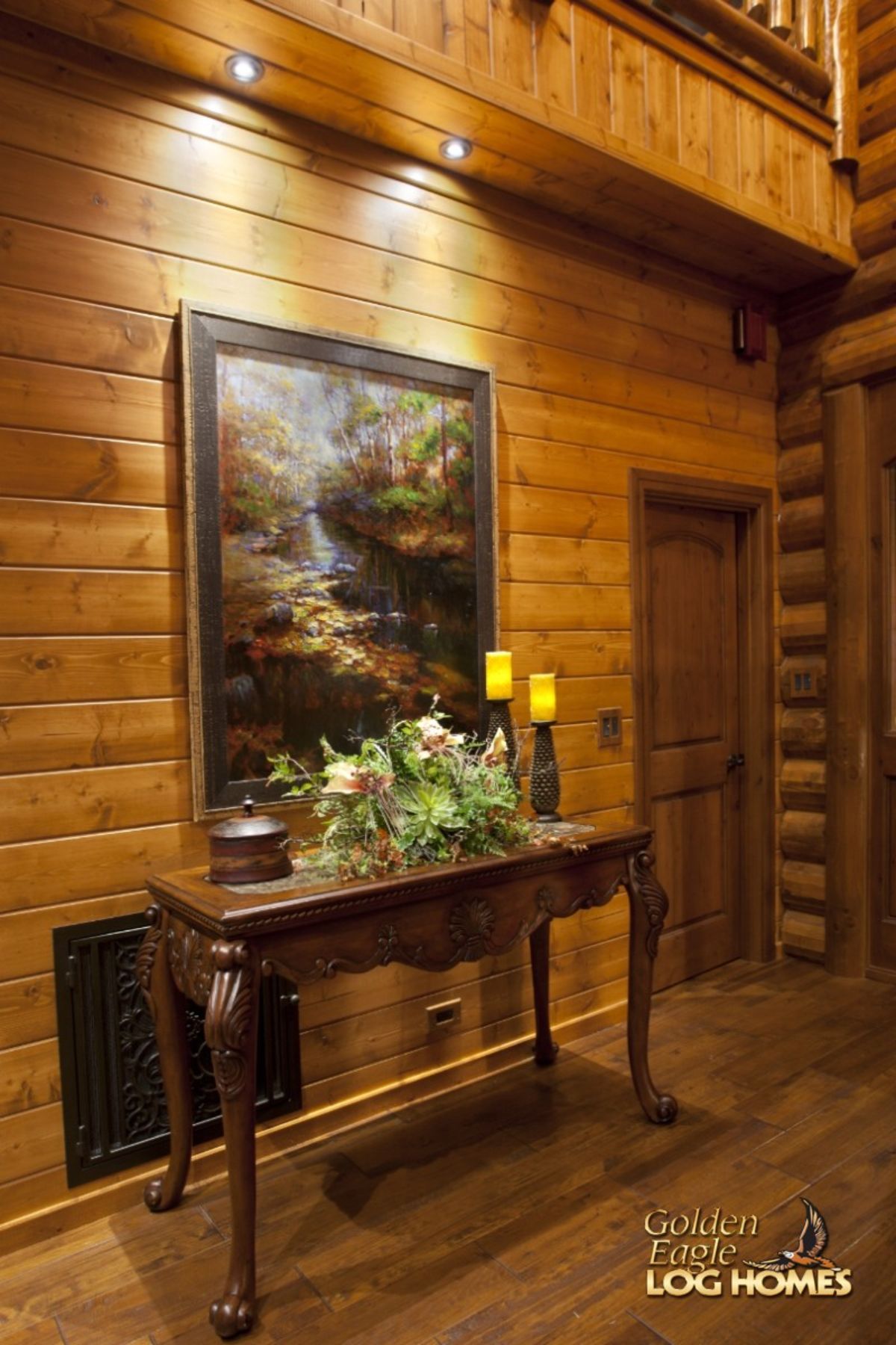 entry table below landscape portrait net to wood door