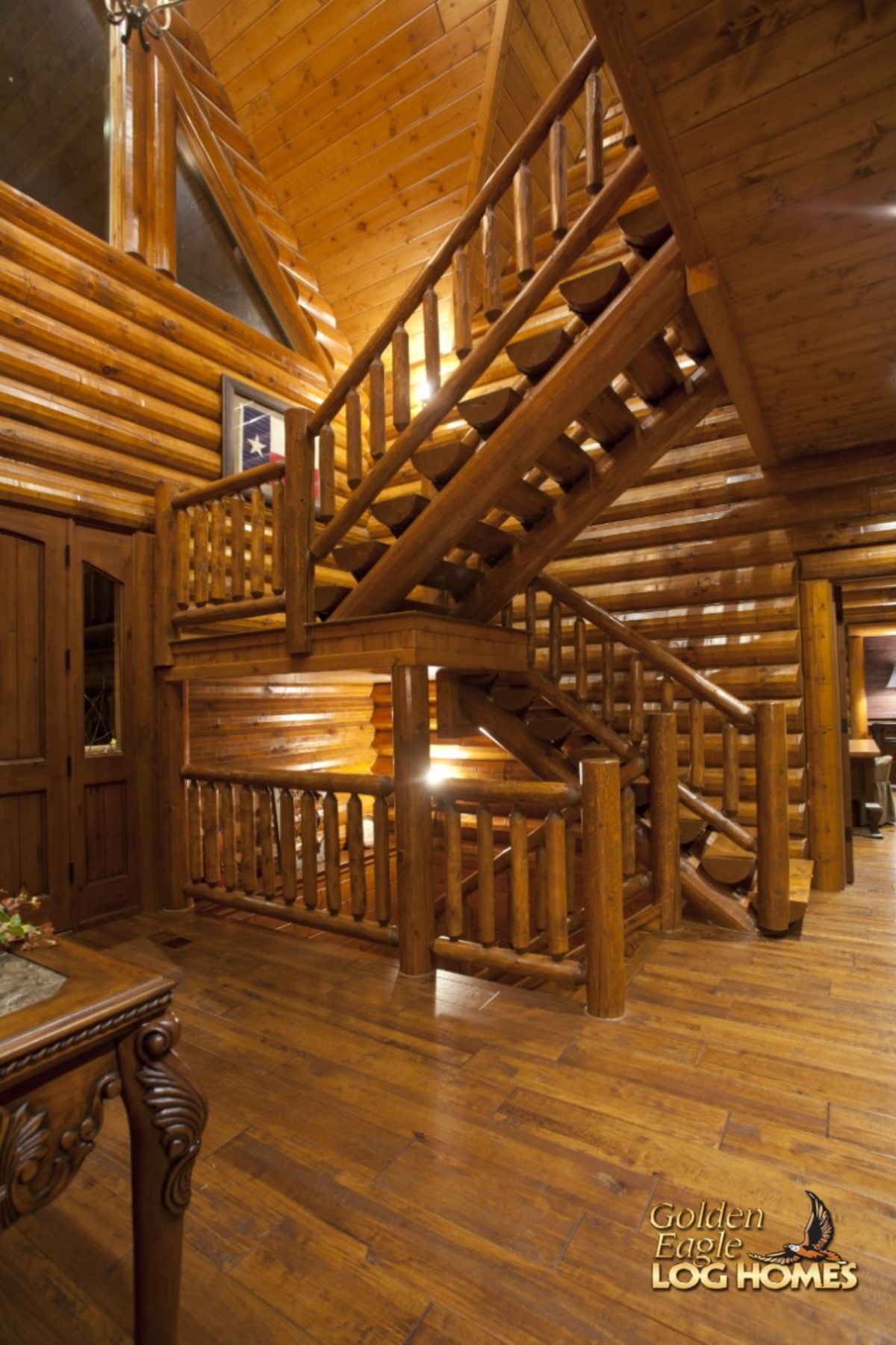 wood staircases going upstairs and downstairs in cabin