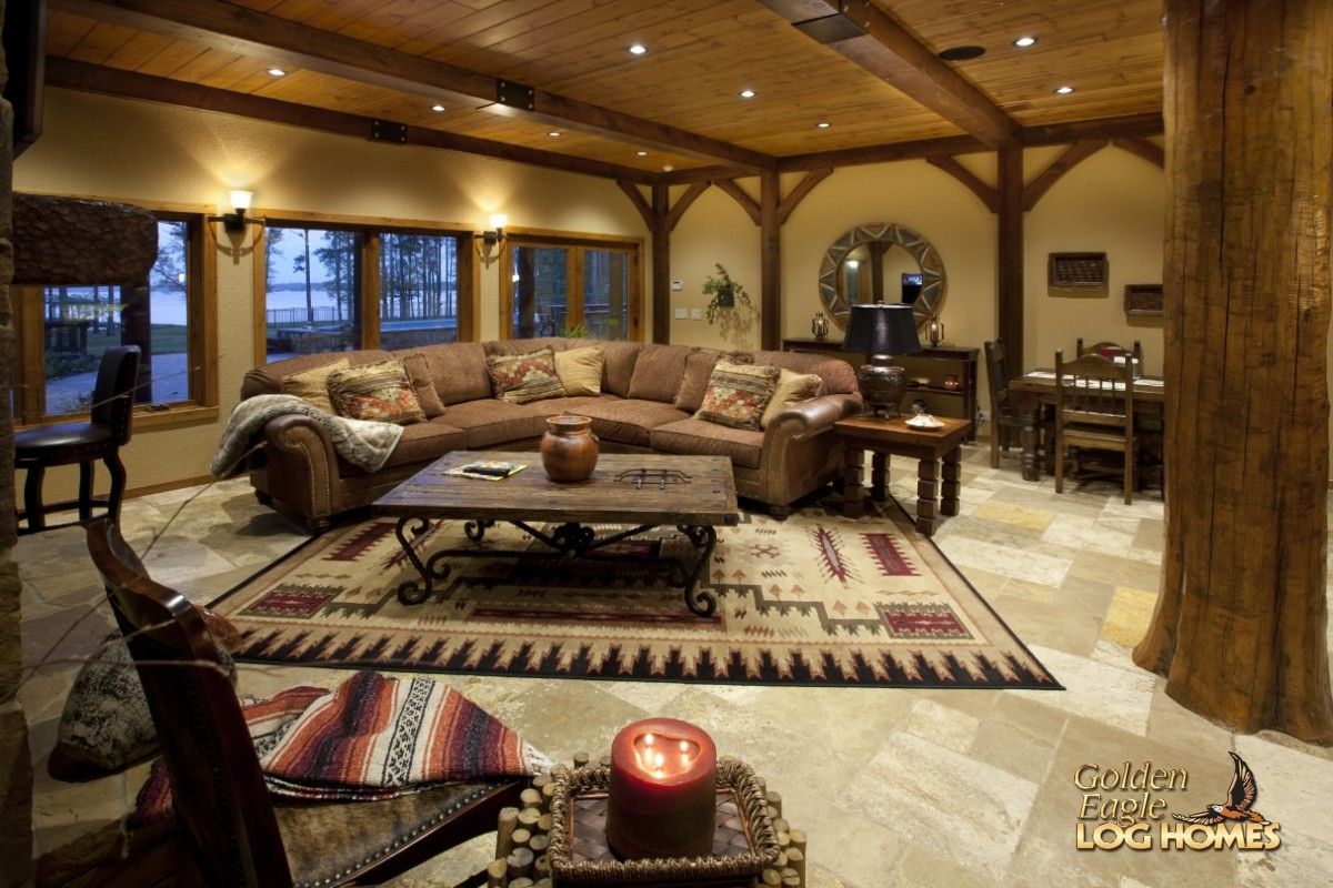 coffee table on southwest theemed rug in front of brown sectional sofa