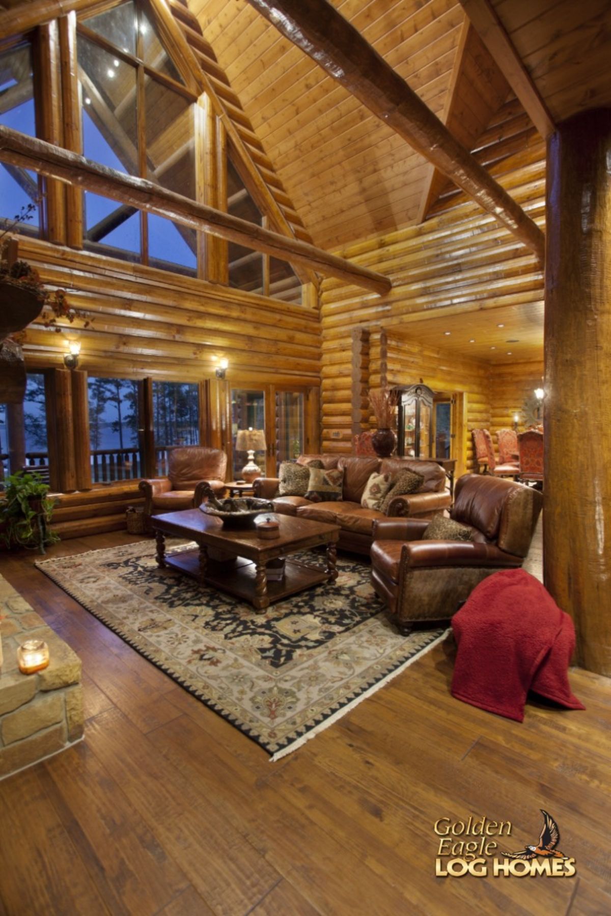 leather recliner in front of table with wall of windows in background