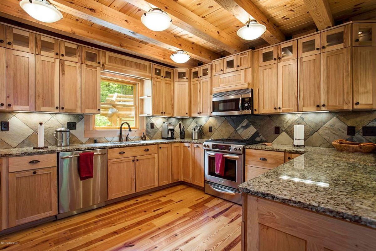 view into kitchen with light wood cabinets and stainless steel appliances