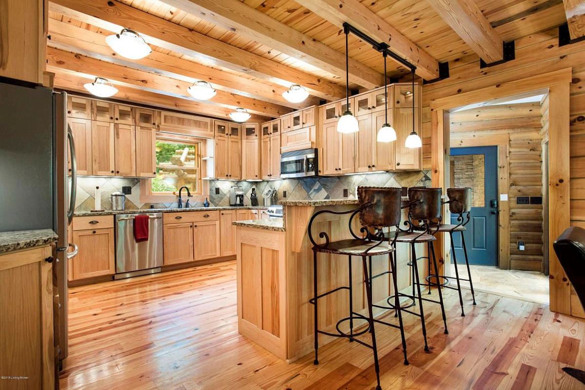 high backed bar stool against outside of kitchen countertop in kitchen