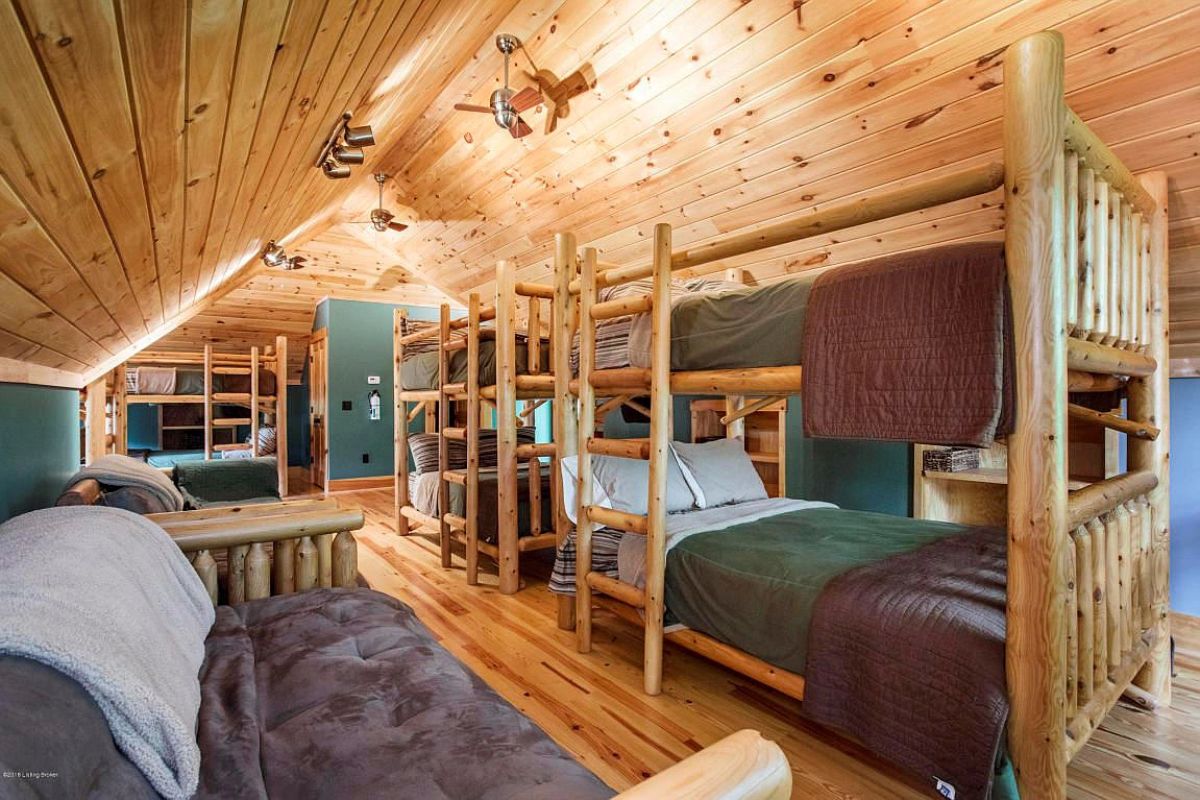 bunk beds in second floor bedroom with teal and purple blankets