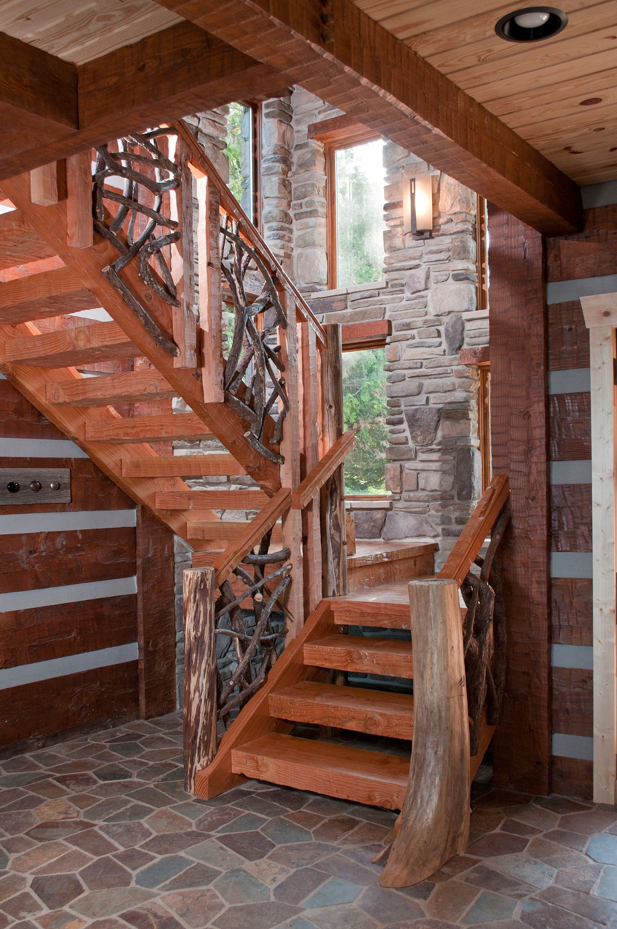 wood stairs against log and stone wall