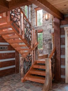 wood stairs against log and stone wall