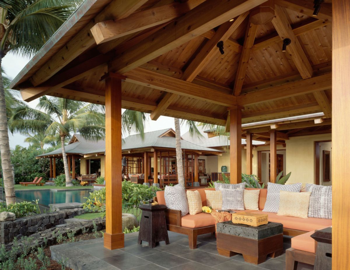 view across patio with peach sofa and white cushions in foreground