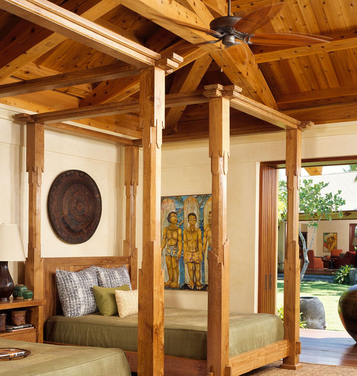 four poster bed against wall with open door on right