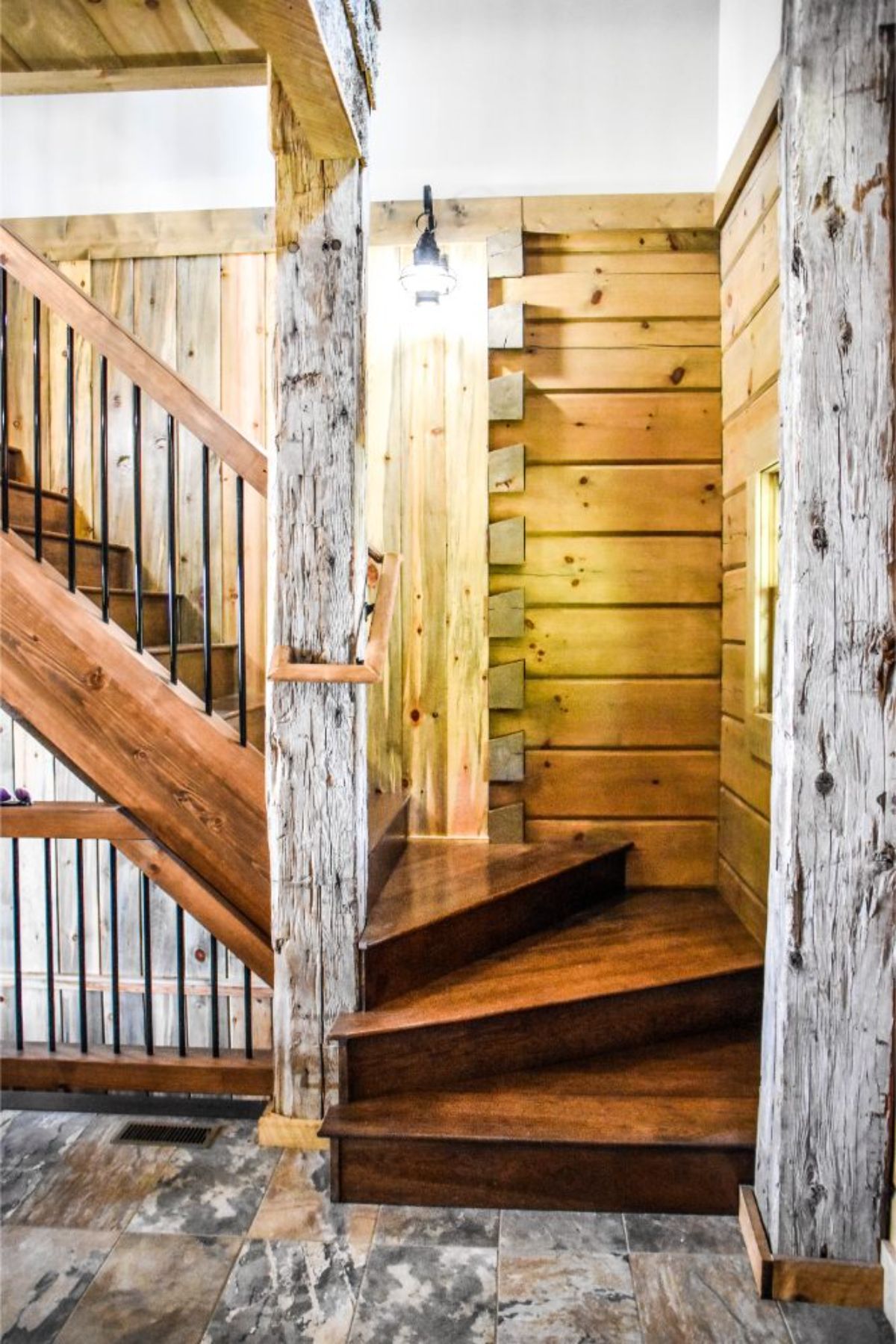 log walls and wood stairs to loft