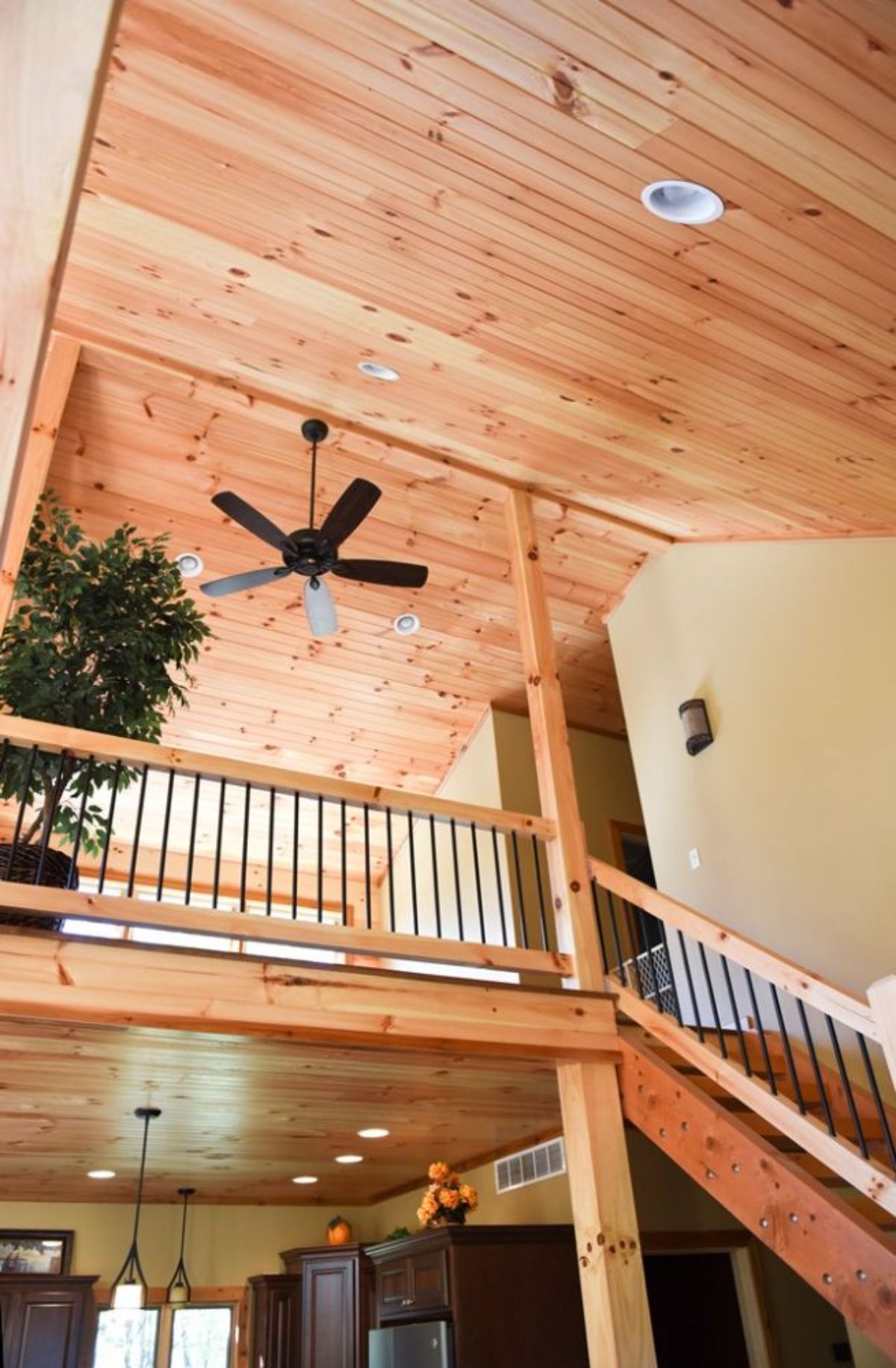 view looking up at open landing in log cabin