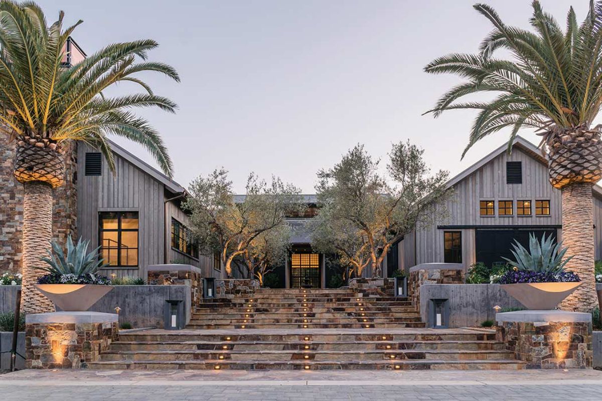 courtyard between two sides of u-shaped home with gray siding