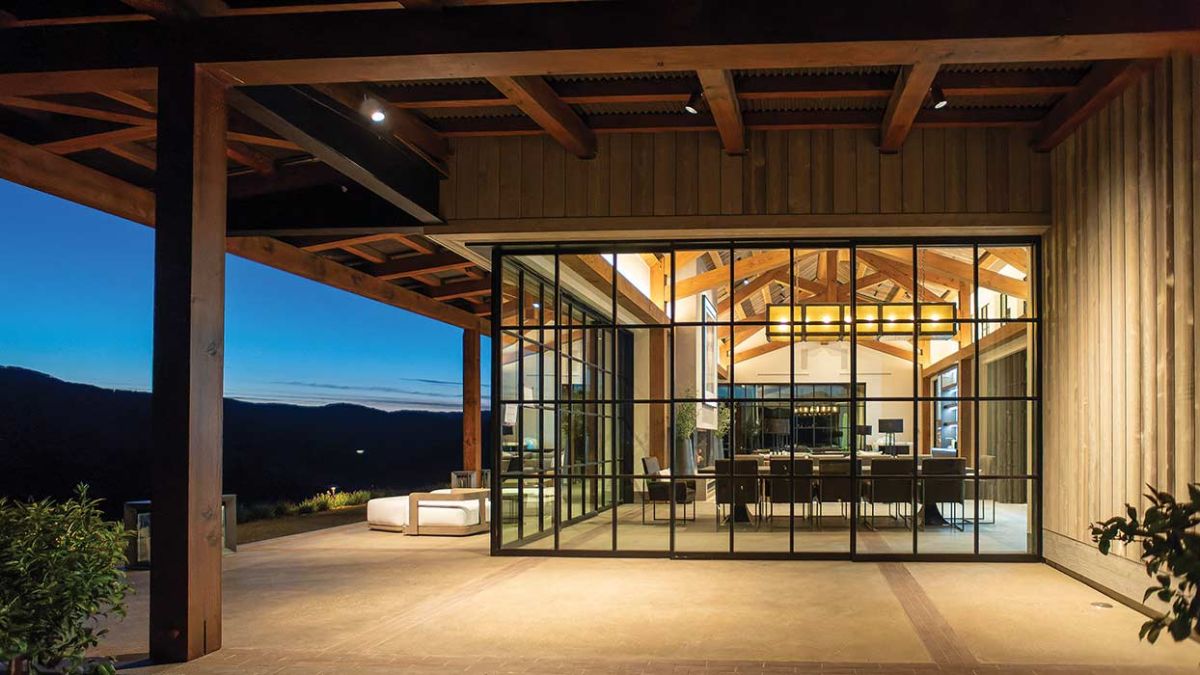 view into living space from deck through wall of windows