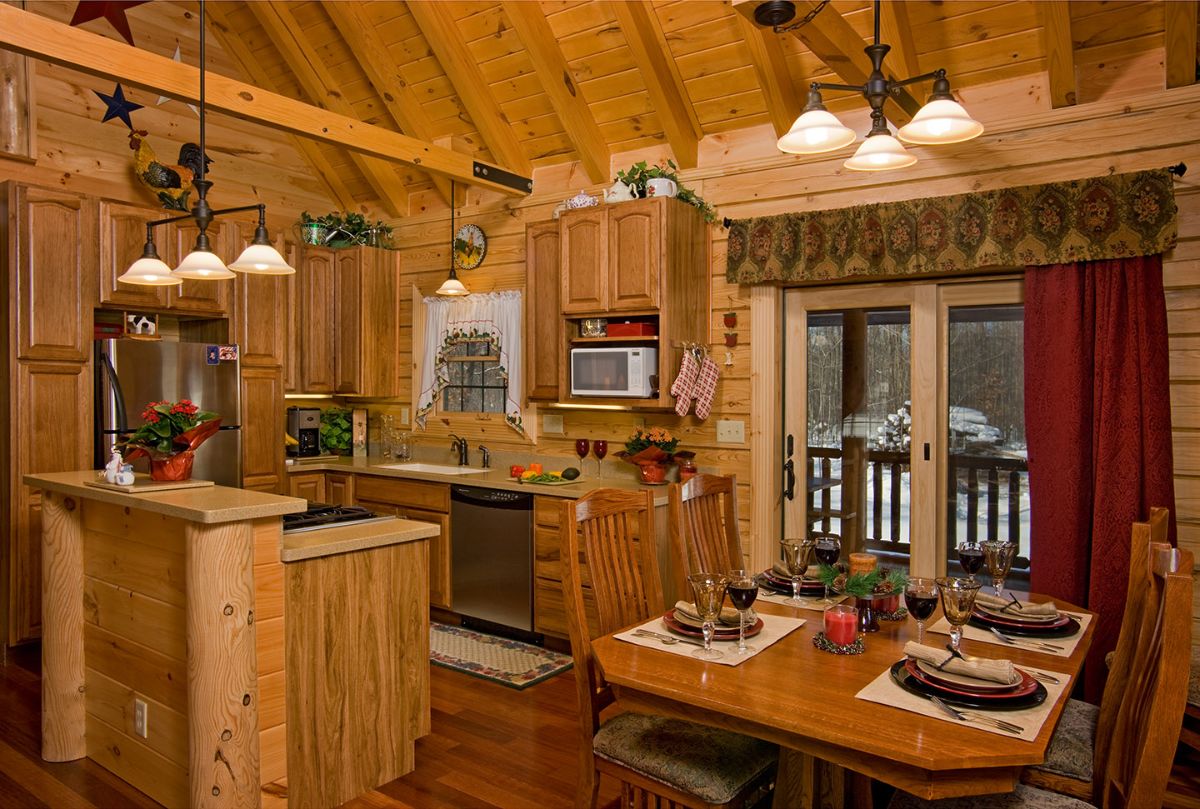 dining table on right with kitchen on left