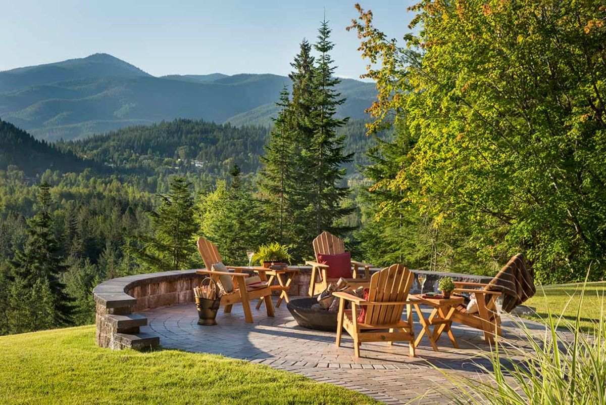 firepit overlooking moutains with adirondack chairs around pit