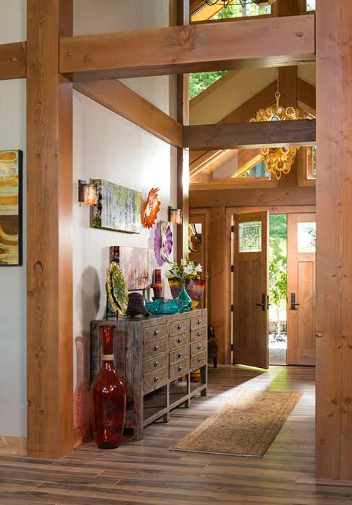 front entry of log cabin with storage bench to left