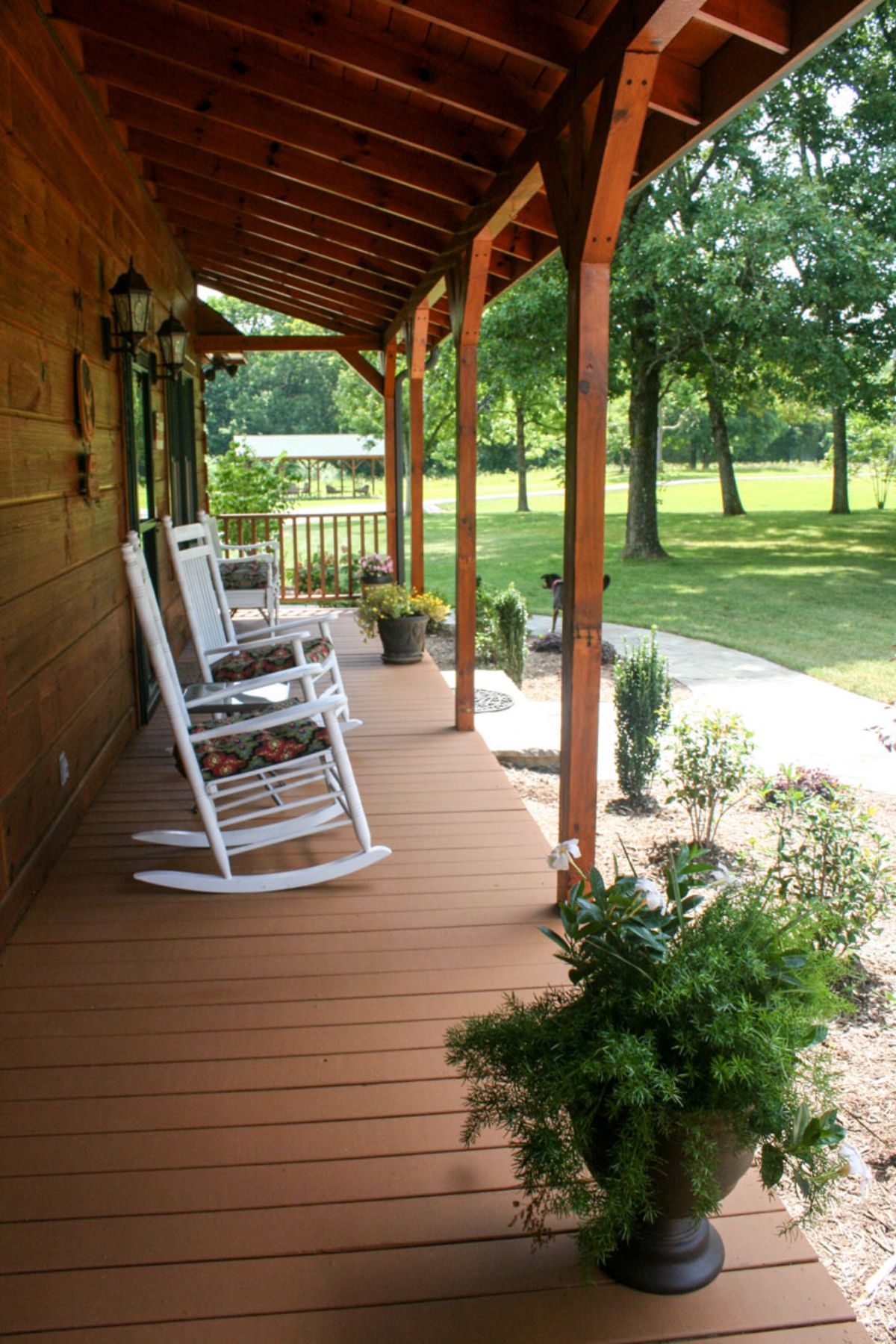 white rocking chair on log cabin porch