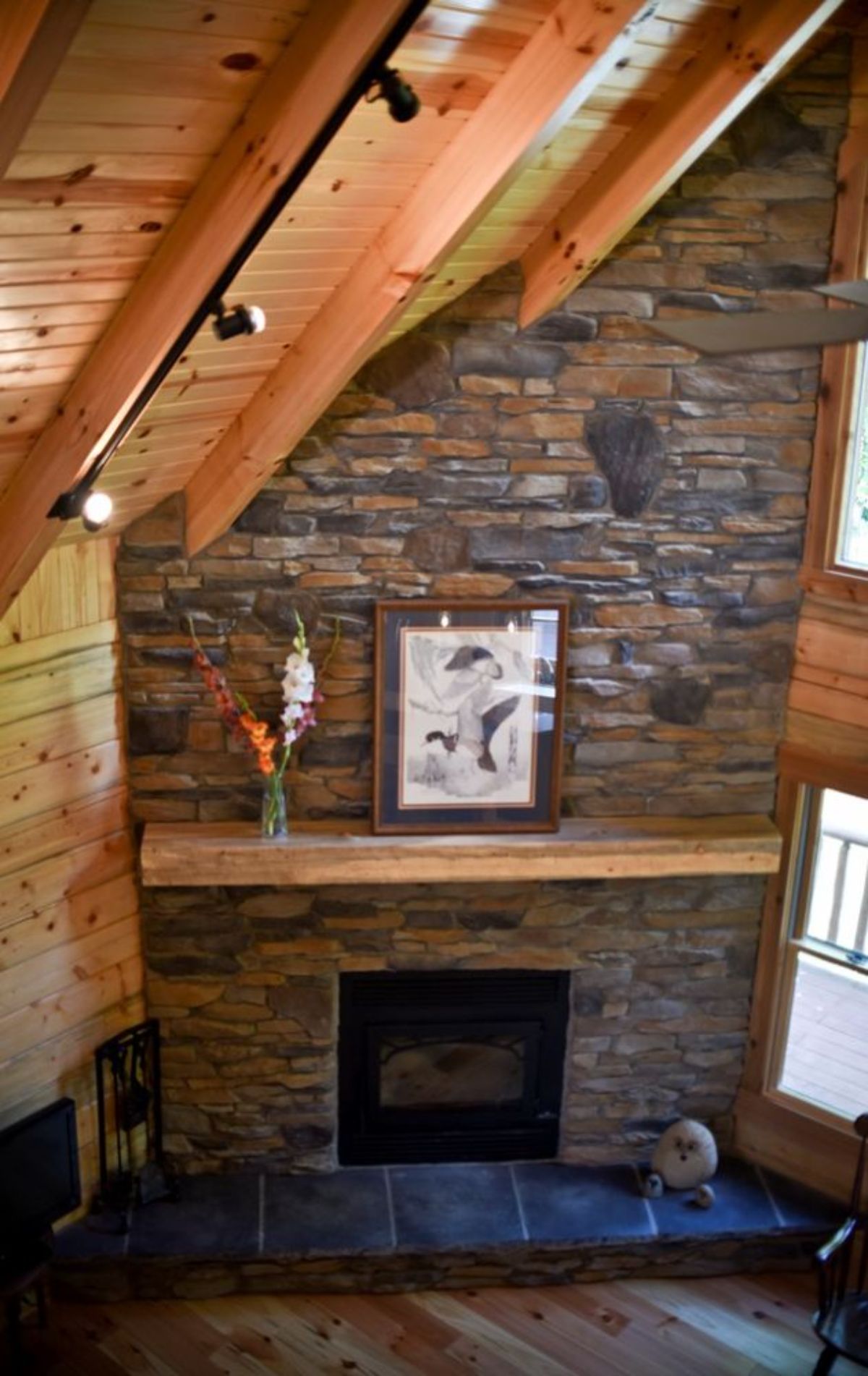view of stone fireplace from above