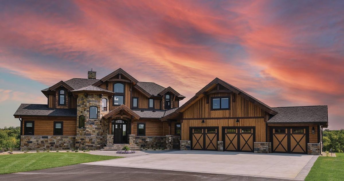 log cabin with sunset in background