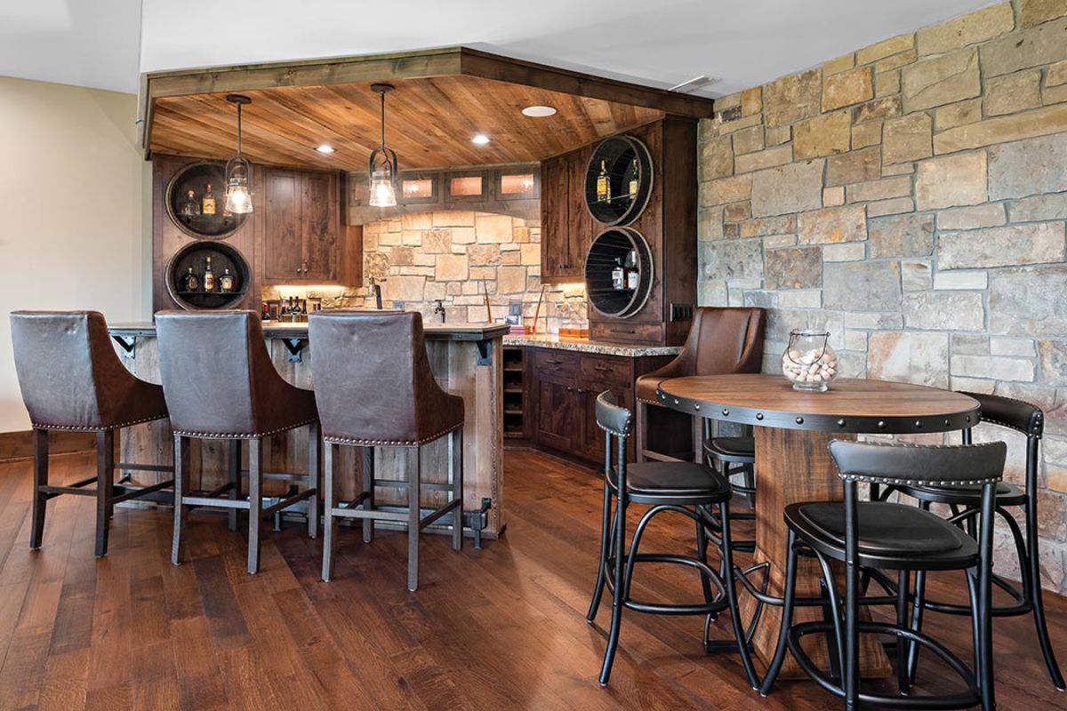 bar in basement with tall back stools and cream brick wall background