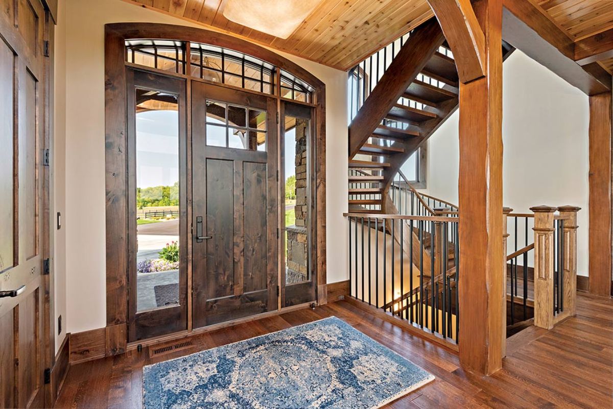 inside front entry to log cabin with glass panels on each side