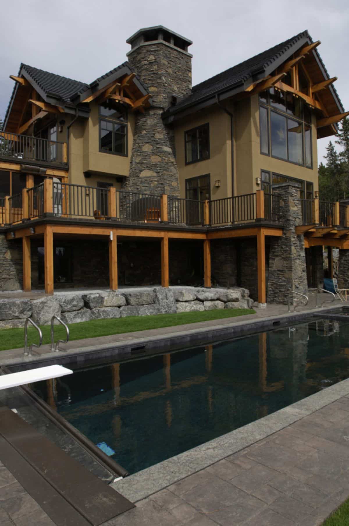 cabin with stone columns on edge of water