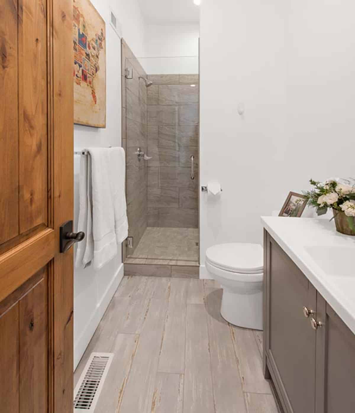 white walls in bathroom with gray tile shower