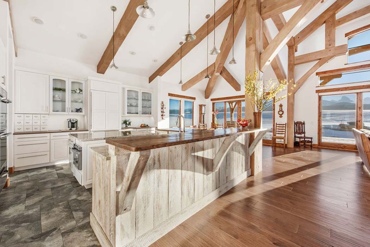 white countertops on island in kitchen with white cabinet background