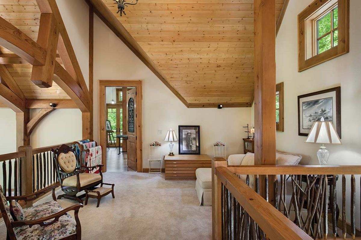 pen landing with white walls and wood ceiling in loft