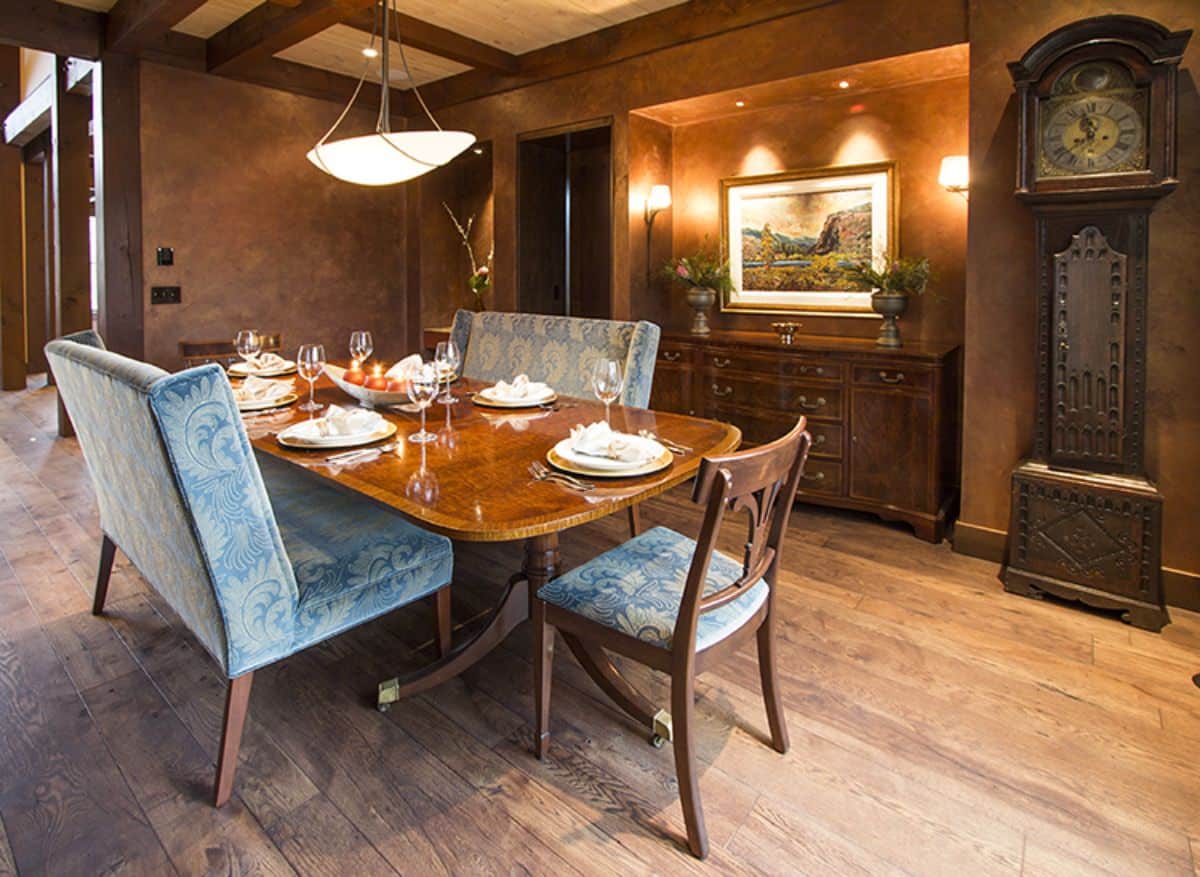 blue chairs around square table in dining room