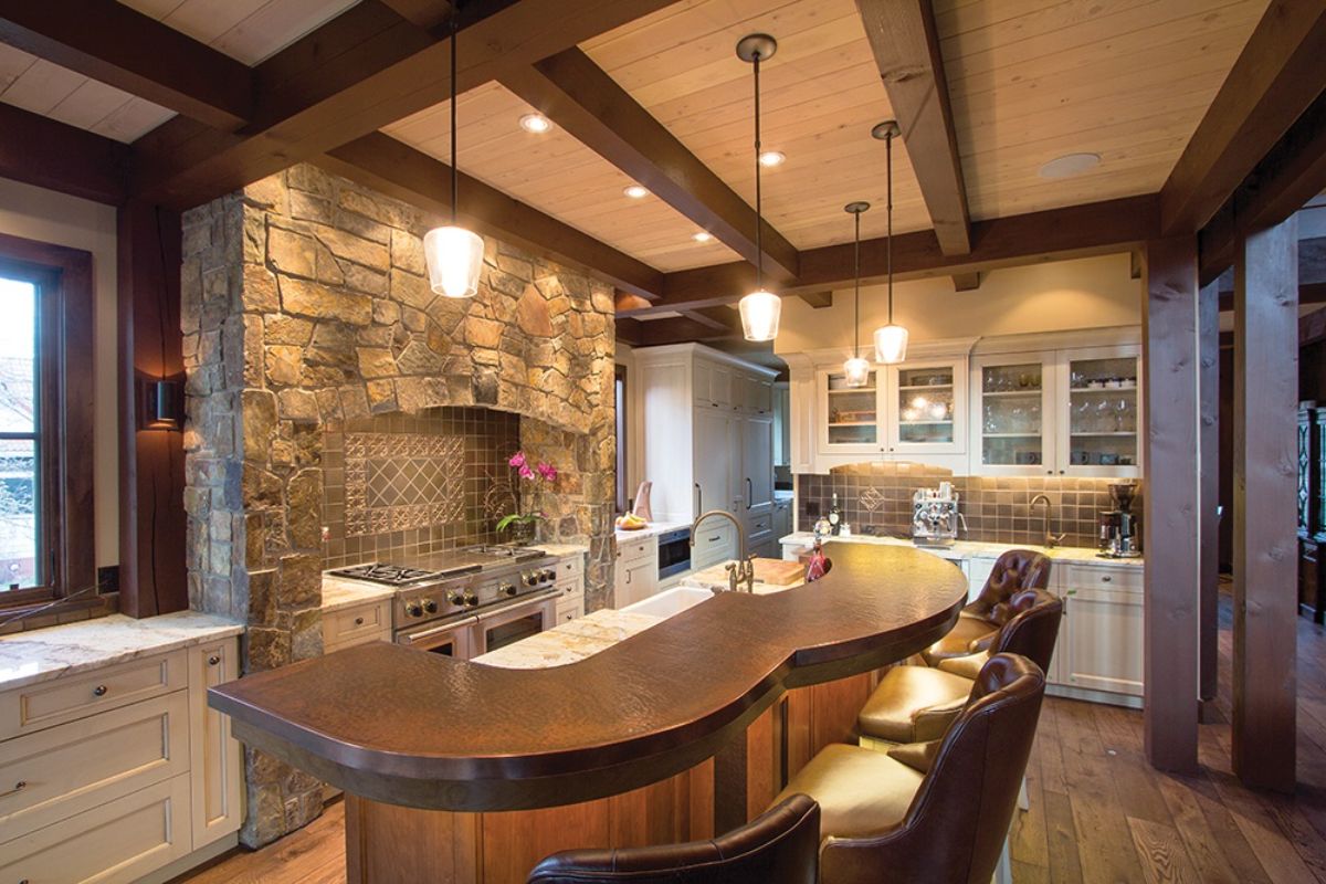 curved bar with stone background and high back leather stools