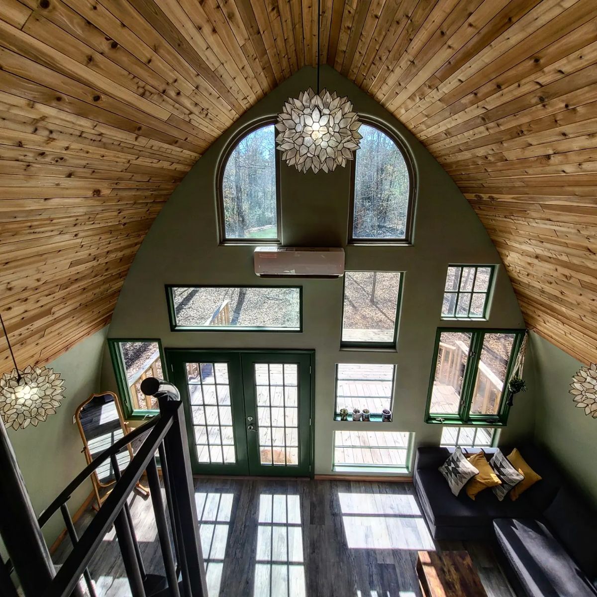 view of windows on back of cabin from loft