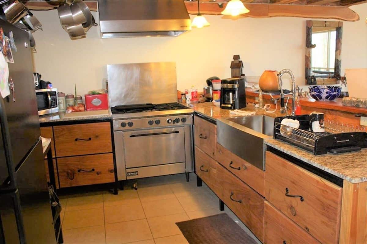 professional kitchen stove against back wall of small cabin kitchen