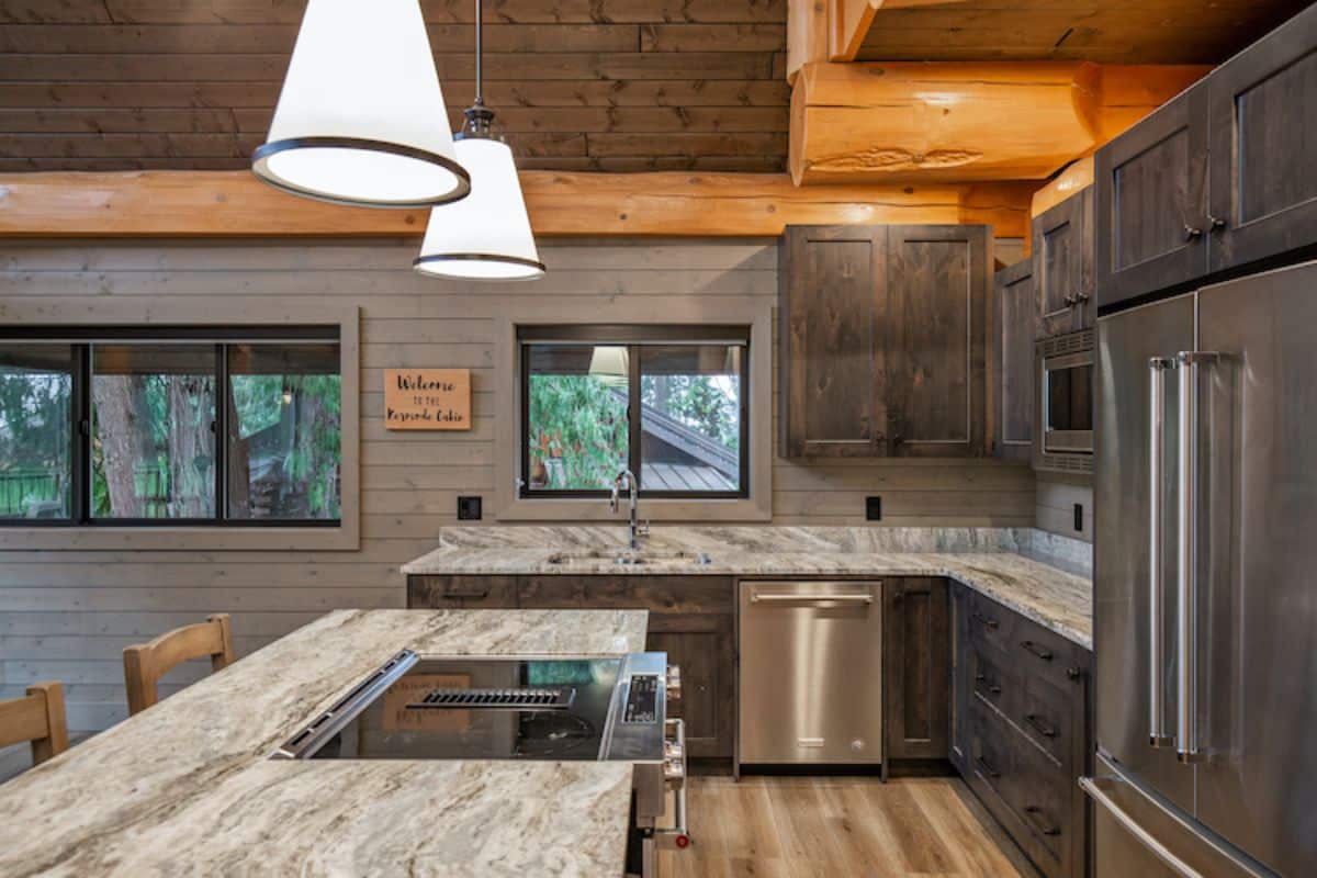 gray countertops on gray wood cabinets in kitchen with light gray walls