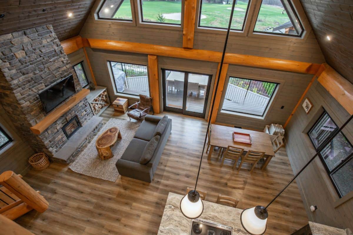 view of living room and dining room from loft