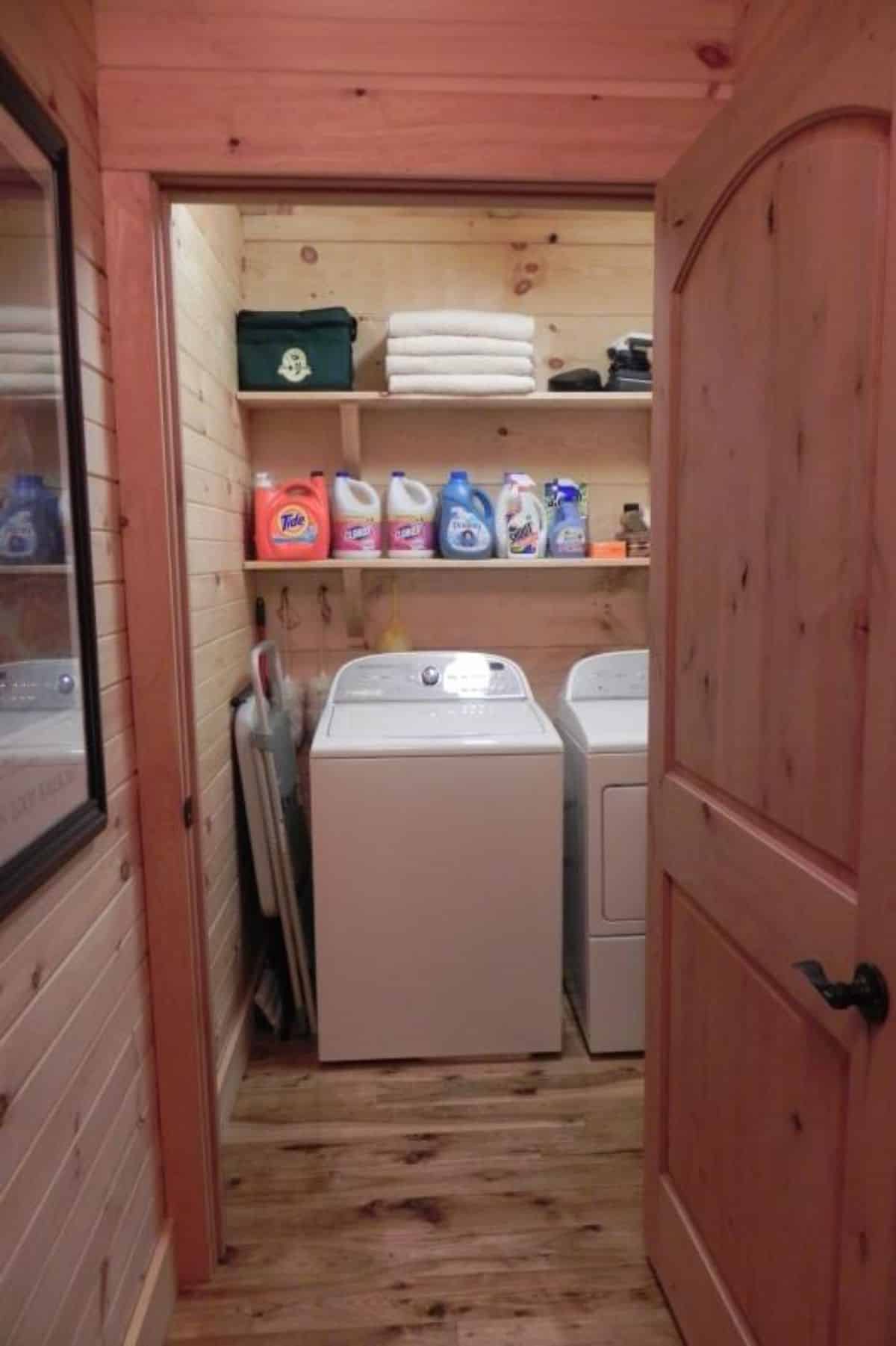 view into laundry room with white washer and dryer
