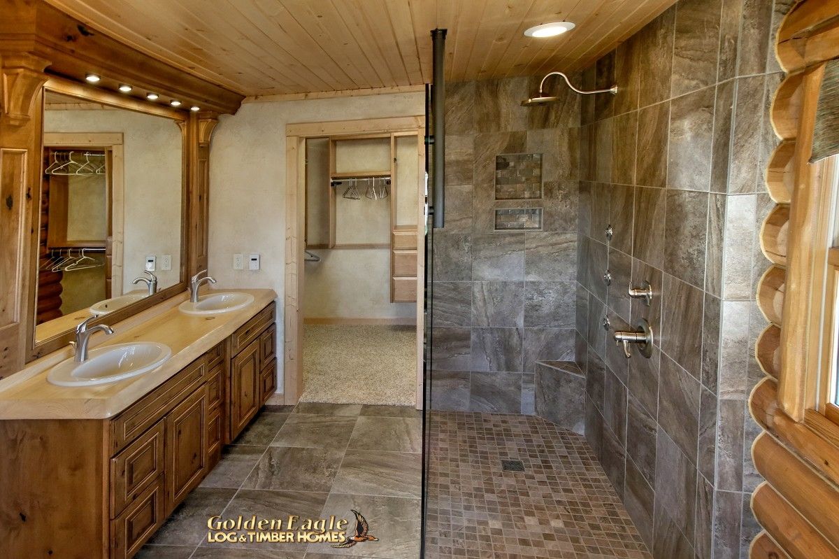 master bathroom with closet in back of space and glass shower on right