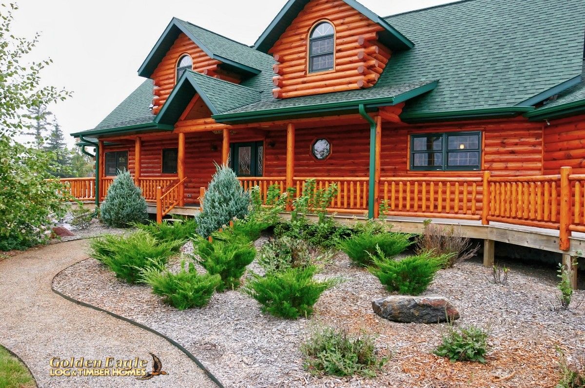 landscaped walkway to front of log cabin