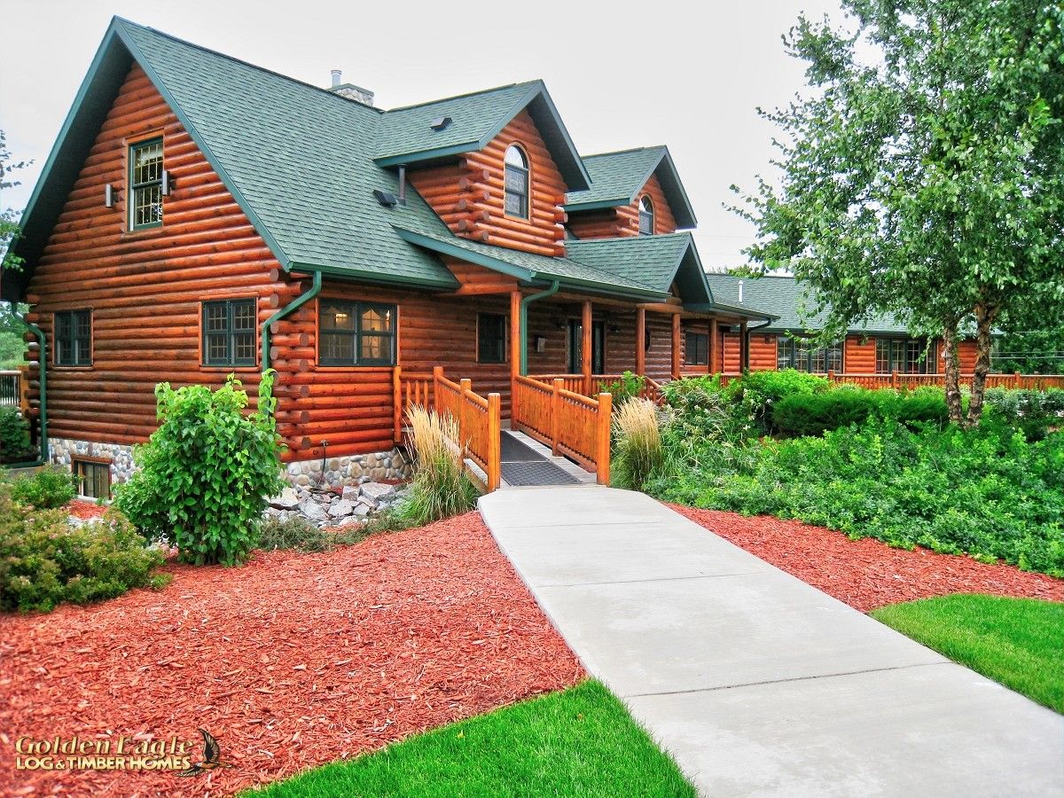 concrete walkway to ramp on log cabin