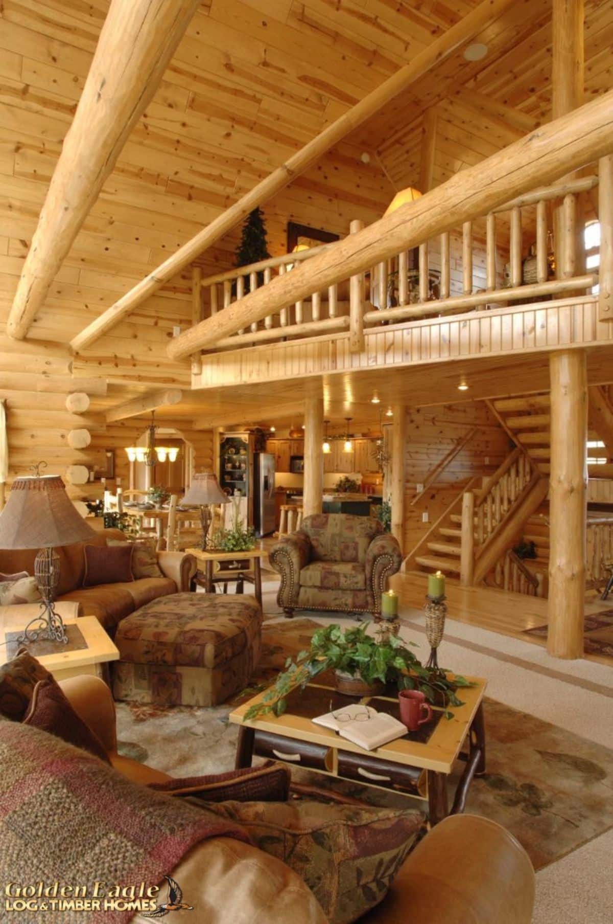 brown sofas and chairs in living room beneath loft