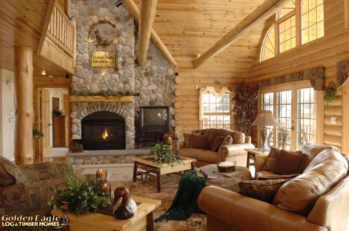 brown chair in foreground with stone fireplace in background