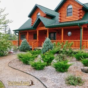 landscaped walkway to front of log cabin