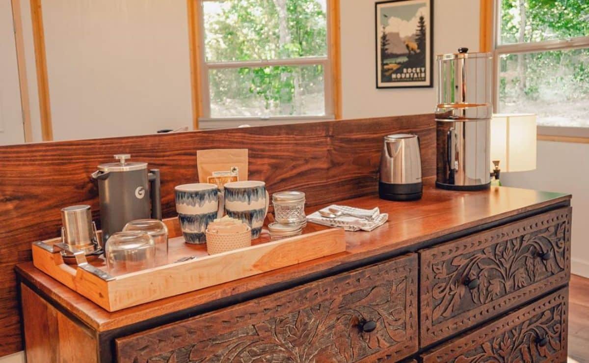 brown ornate cabinets under butcher block countertop