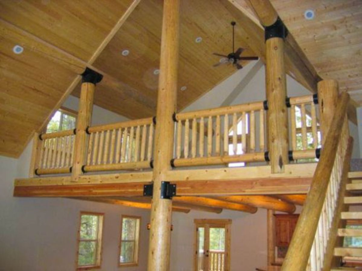 light wood loft above living space in cabin