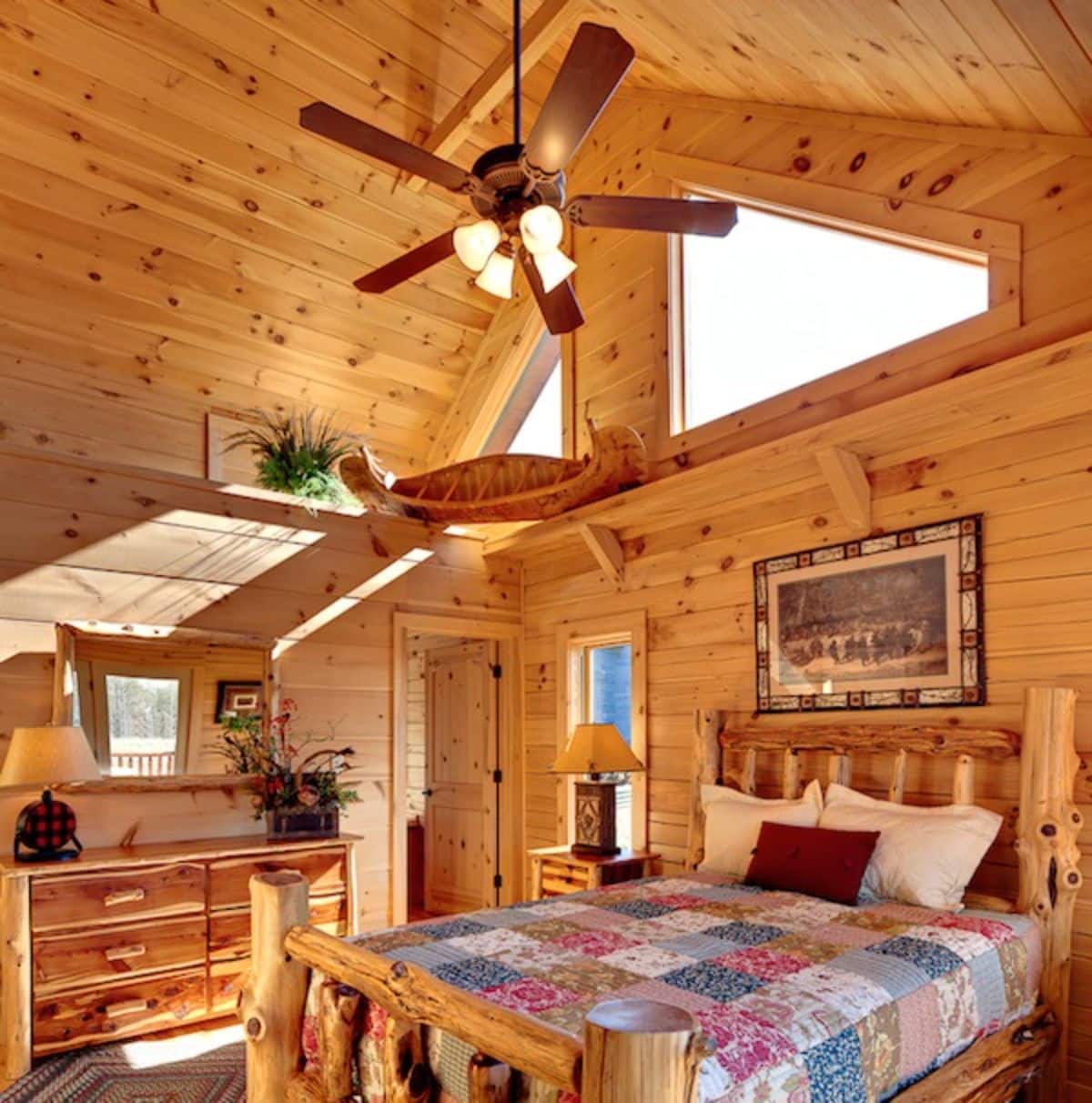 ceiling fan hanging above bed