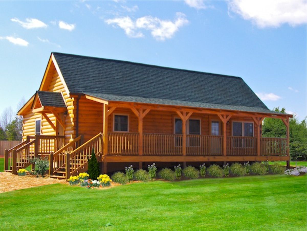 side of log cabin with covered porch