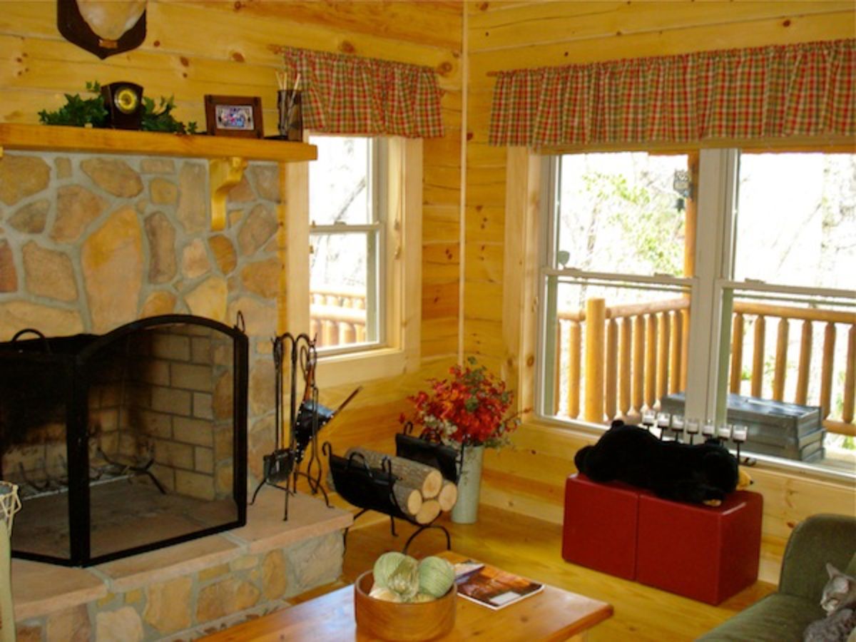 corner of room showing windows looking out over porch next to fireplace