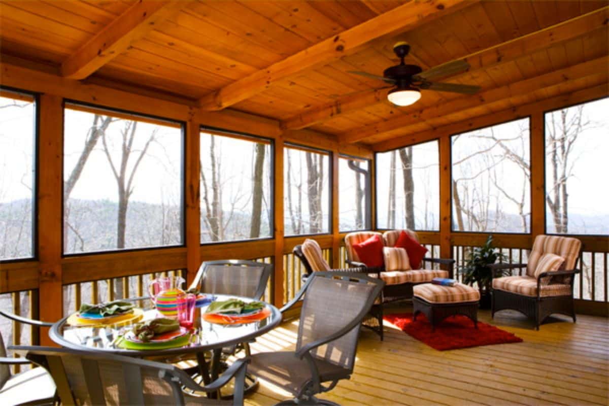 bistro set and lounge under roof of covered porch