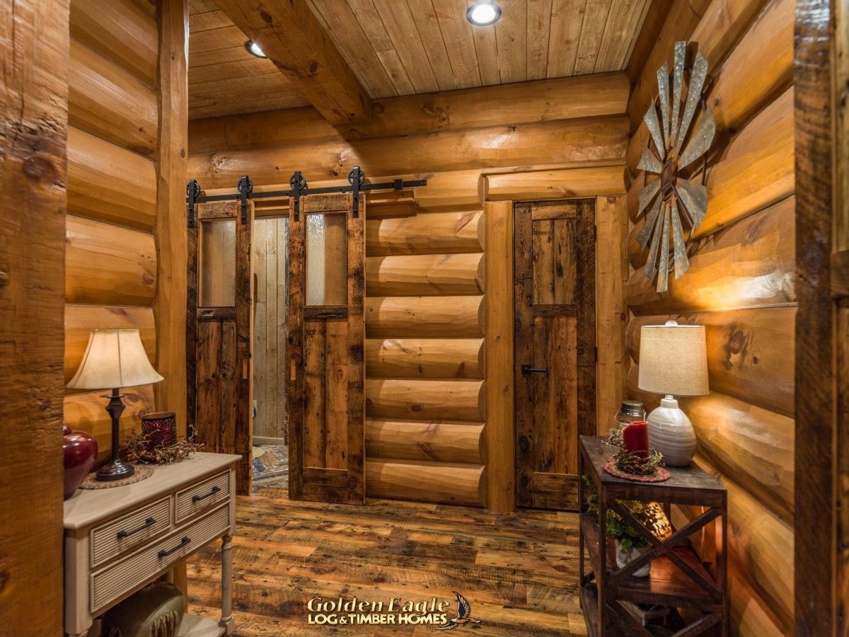 barn door closure on bathroom in backgrun dof log cabin entry