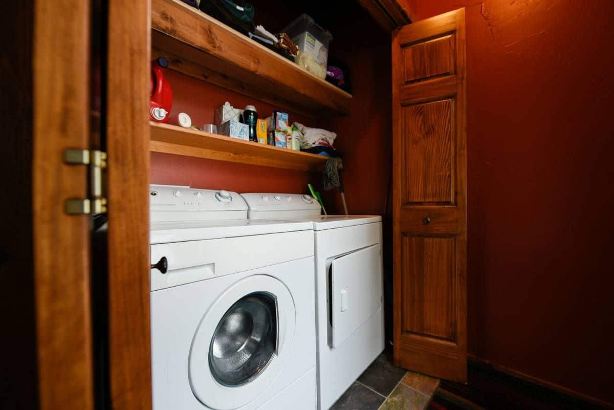 white washer and dryer in closet