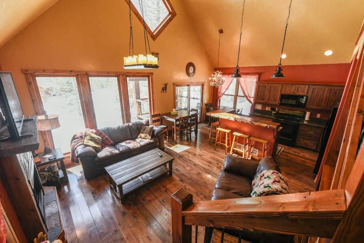 view of living room and kitchen from stairs